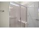 Walk-in shower with glass enclosure and built-in seat at 9411 Sw 54Th St, Ocala, FL 34481