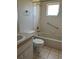 Bathroom includes a shower/tub combo and tile flooring at 9794 Sw 96Th St, Ocala, FL 34481