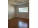 Bright bedroom featuring laminate wood flooring at 9794 Sw 96Th St, Ocala, FL 34481