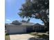 One-story home with attached garage and mature landscaping at 9794 Sw 96Th St, Ocala, FL 34481