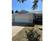 House exterior showcasing a two car garage and well maintained lawn at 9794 Sw 96Th St, Ocala, FL 34481