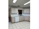 Bright kitchen with white cabinets and a dishwasher at 9794 Sw 96Th St, Ocala, FL 34481