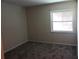 Bedroom with carpet and a window at 100 Sweetgum Woods Ct # 8C, Deltona, FL 32725