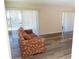 Living room with sofa and vinyl flooring at 100 Sweetgum Woods Ct # 8C, Deltona, FL 32725