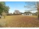 Large backyard with home and wooden fence at 10628 Sw 74Th Ave, Ocala, FL 34476