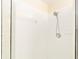 Shower stall with white tile and a handheld showerhead at 10628 Sw 74Th Ave, Ocala, FL 34476