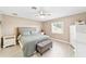 Bright bedroom with a queen-size bed and plenty of storage at 10628 Sw 74Th Ave, Ocala, FL 34476