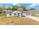 Single story home with gray exterior and landscaping at 10628 Sw 74Th Ave, Ocala, FL 34476