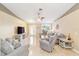 Living room with vaulted ceilings and neutral color palette at 10628 Sw 74Th Ave, Ocala, FL 34476