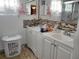 Bathroom with double vanity and a laundry hamper at 10800 Sw 62Nd Ave, Ocala, FL 34476