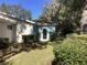 Landscaped backyard with mature trees and lush greenery at 10829 Sw 83Rd Ave, Ocala, FL 34481