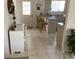 Eat-in kitchen with access to backyard and breakfast bar at 10829 Sw 83Rd Ave, Ocala, FL 34481