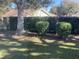 Landscaped yard with lush greenery and neatly trimmed hedges at 10829 Sw 83Rd Ave, Ocala, FL 34481