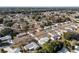 Wide aerial view of a neighborhood with many houses and trees at 11253 Sw 77Th Ct, Ocala, FL 34476