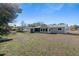 Large backyard with a view of the home exterior at 11253 Sw 77Th Ct, Ocala, FL 34476