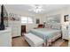 Bedroom with a floral comforter and built in dresser at 11253 Sw 77Th Ct, Ocala, FL 34476