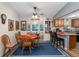 Bright dining area with wood table and chairs, near kitchen at 11253 Sw 77Th Ct, Ocala, FL 34476