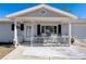 Inviting front porch with rocking chairs, perfect for relaxing at 11253 Sw 77Th Ct, Ocala, FL 34476