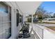 Relaxing front porch with rocking chairs and street view at 11253 Sw 77Th Ct, Ocala, FL 34476