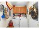 Laundry room featuring washer, dryer, and wooden cabinets at 11253 Sw 77Th Ct, Ocala, FL 34476