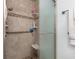 Walk-in shower with grab bars and tiled walls at 11253 Sw 77Th Ct, Ocala, FL 34476