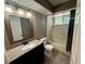 Bathroom with tub, toilet and granite vanity at 11440 Sw 85Th Ave, Ocala, FL 34481