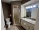 Bathroom with shower, toilet and granite vanity at 11440 Sw 85Th Ave, Ocala, FL 34481