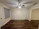 Bedroom with wood floor and door to outside at 11440 Sw 85Th Ave, Ocala, FL 34481