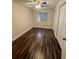 Bedroom with wood floor and double door closet at 11440 Sw 85Th Ave, Ocala, FL 34481