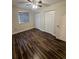 Bedroom with wood floor and double door closet at 11440 Sw 85Th Ave, Ocala, FL 34481