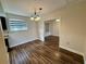 Spacious dining room featuring hardwood floors and elegant light fixture at 11440 Sw 85Th Ave, Ocala, FL 34481