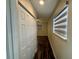 Hallway with double door closet and window blinds at 11440 Sw 85Th Ave, Ocala, FL 34481