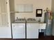 Laundry room with washer, dryer, and utility sink at 11440 Sw 85Th Ave, Ocala, FL 34481