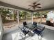 Bright screened porch with table and chairs, overlooks backyard at 11440 Sw 85Th Ave, Ocala, FL 34481