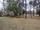 Backyard with lush landscaping and trees at 11577 Sw 72Nd Cir, Ocala, FL 34476