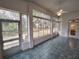 Bright sunroom with tiled floor and sliding doors at 11577 Sw 72Nd Cir, Ocala, FL 34476