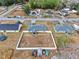 Aerial view of the property, surrounding neighborhood, nearby houses, and fencing at 12 Pine Trace Pl, Ocala, FL 34472