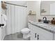 Bright bathroom with a shower, white vanity, new fixtures and granite countertops at 12 Pine Trace Pl, Ocala, FL 34472