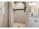 Modern bathroom with a shower,granite countertop, and white vanity at 12 Pine Trace Pl, Ocala, FL 34472