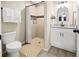 Updated bathroom featuring a tiled shower, modern vanity, and contemporary fixtures at 12 Pine Trace Pl, Ocala, FL 34472