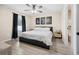 Spacious bedroom with king-size bed and ceiling fan at 12 Pine Trace Pl, Ocala, FL 34472