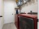 Functional laundry room with modern washer and dryer, storage shelves and convenient access at 12 Pine Trace Pl, Ocala, FL 34472