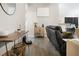 Living room with hardwood floors, sectional sofa, and console table at 12 Pine Trace Pl, Ocala, FL 34472