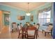 Bright dining room with wood table and six chairs at 12955 Se 93Rd Cir, Summerfield, FL 34491