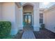 Elegant entryway with double doors and a brick pathway at 12955 Se 93Rd Cir, Summerfield, FL 34491