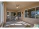 Sunroom with seating area and view of the golf course at 12955 Se 93Rd Cir, Summerfield, FL 34491