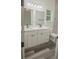 Bathroom with double vanity and marble shower at 13055 Ne 7Th Loop, Silver Springs, FL 34488