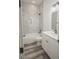 Bathroom featuring a bathtub, shower, and grey flooring at 13055 Ne 7Th Loop, Silver Springs, FL 34488