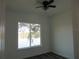 Bright room with ceiling fan and a view of the lake at 13055 Ne 7Th Loop, Silver Springs, FL 34488