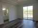 Bedroom with en-suite bathroom and sliding doors leading to the deck at 13055 Ne 7Th Loop, Silver Springs, FL 34488